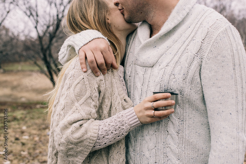 couple hugging on a pier