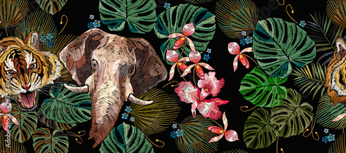 Embroidery tiger, elephants, palm leaves and orchid flowers horizontal seamless pattern. Tropical art. Jungle summer concept. Fashionable template for clothes, t-shirt design