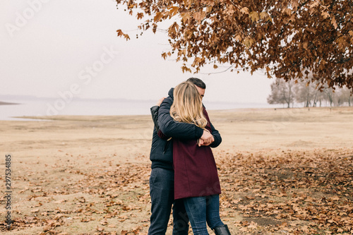 couple in love cuddles in the park
