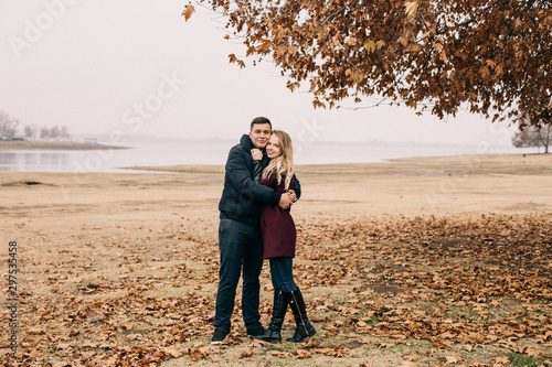 couple in love cuddles in the park