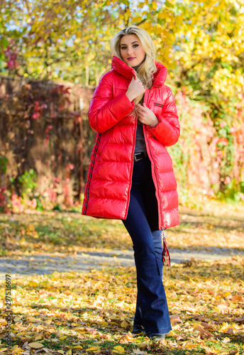 Autumn season fashion. Girl enjoy autumn walk. Clothing for autumn walk. Woman wear coat or warm jacket while walk in park nature background. Must have fall wardrobe. Feel cozy and warm this autumn