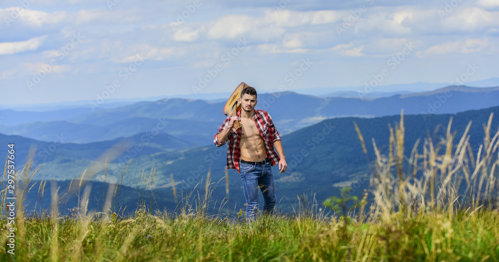 Discover sounds of nature. Musician hiker find inspiration in mountains. Peaceful hiker. Conquer the peaks. Man hiker with guitar walking on mountain. Guy hiker enjoy pure nature. Carefree wanderer