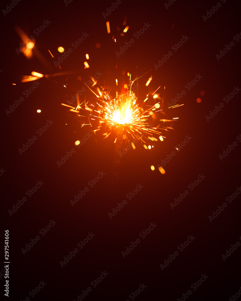 Obraz premium Christmas sparkler in haze with red light
