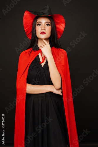 Asian beautiful woman in witches hat and costume in halloween festival.