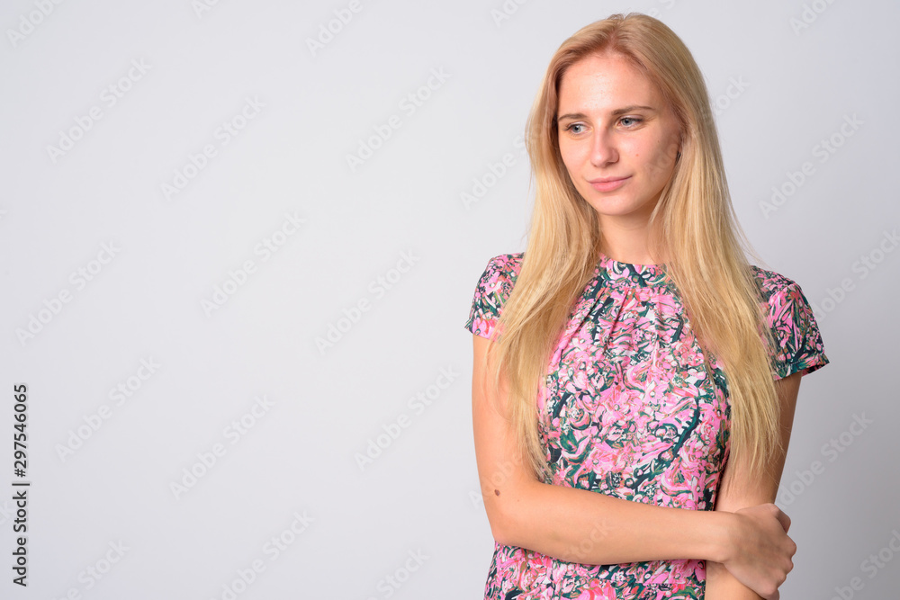 Portrait of young beautiful blonde woman looking down Portrait of young beautiful blonde woman looking down