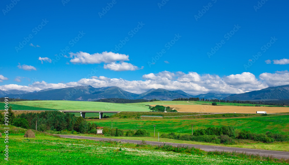 Beautiful summer landscape with the road against Tatra mountains, Slovakia