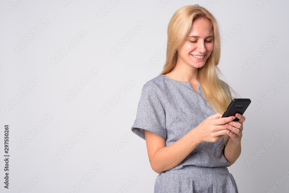 Portrait of happy young beautiful blonde woman using phone Portrait of happy young beautiful blonde woman using phone