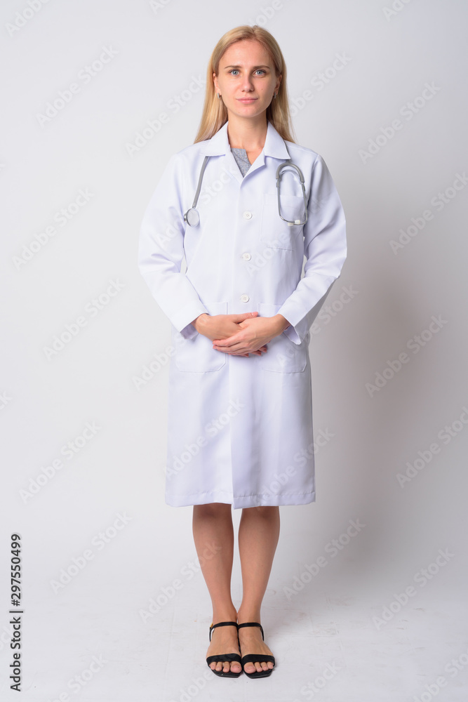 Full body shot of young blonde woman doctor Full body shot of young blonde woman doctor