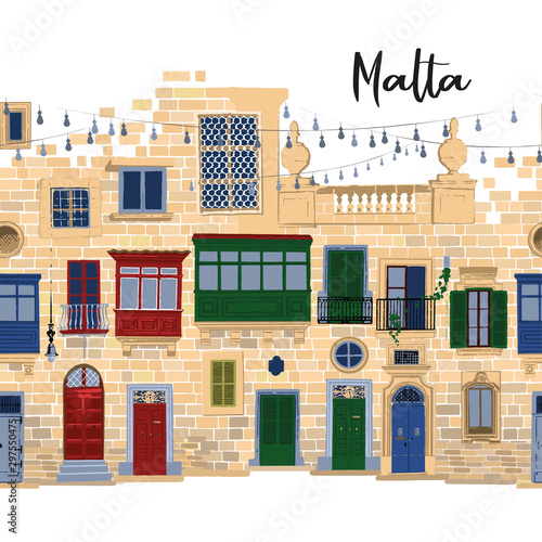 Traditional maltese houses made of sandy stone bricks with various doors, windows and balconies.