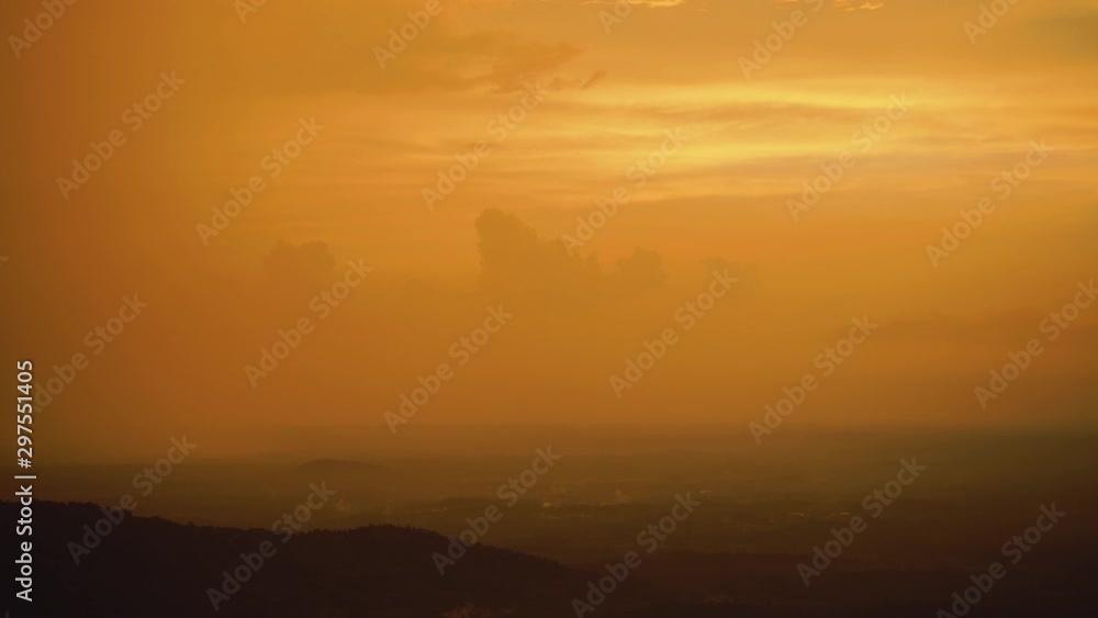 View from the top of a mountain, a landscape covered with mist, post sunset 
