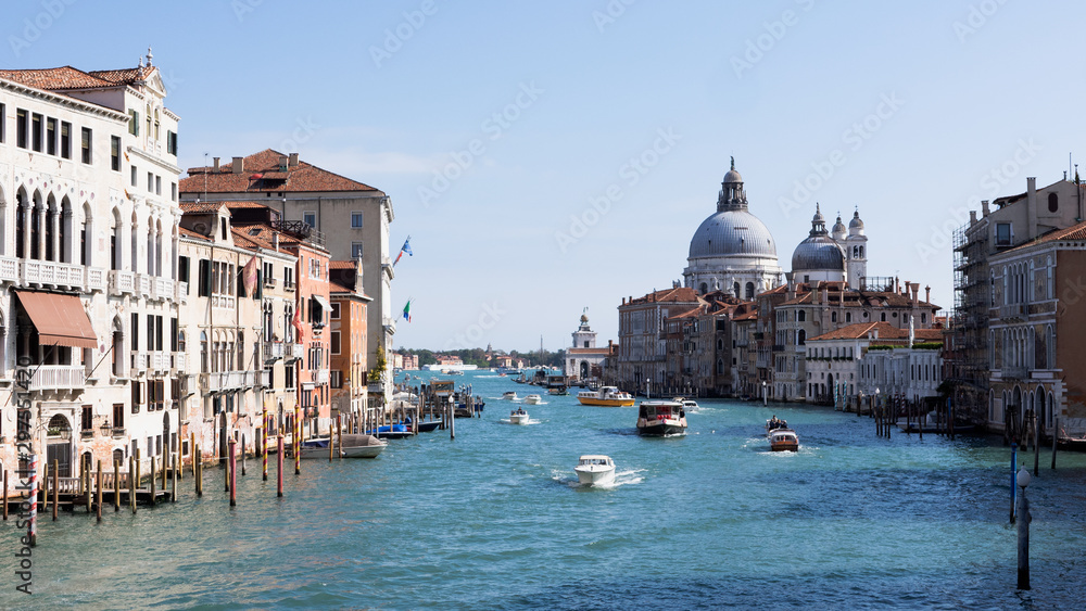 Beautiful view of the Basilica di Santa Maria della Salute from the Grand Canal bridge in Venice, Italy.