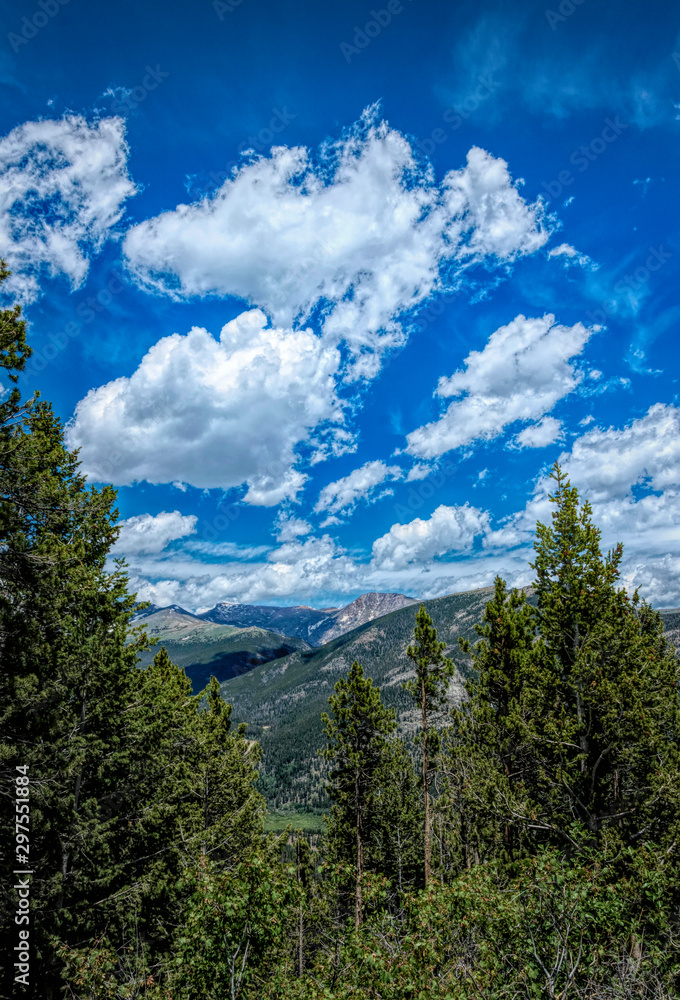 Rocky Mountains summer green panorama in Colorado, USA. Mountains and clouds