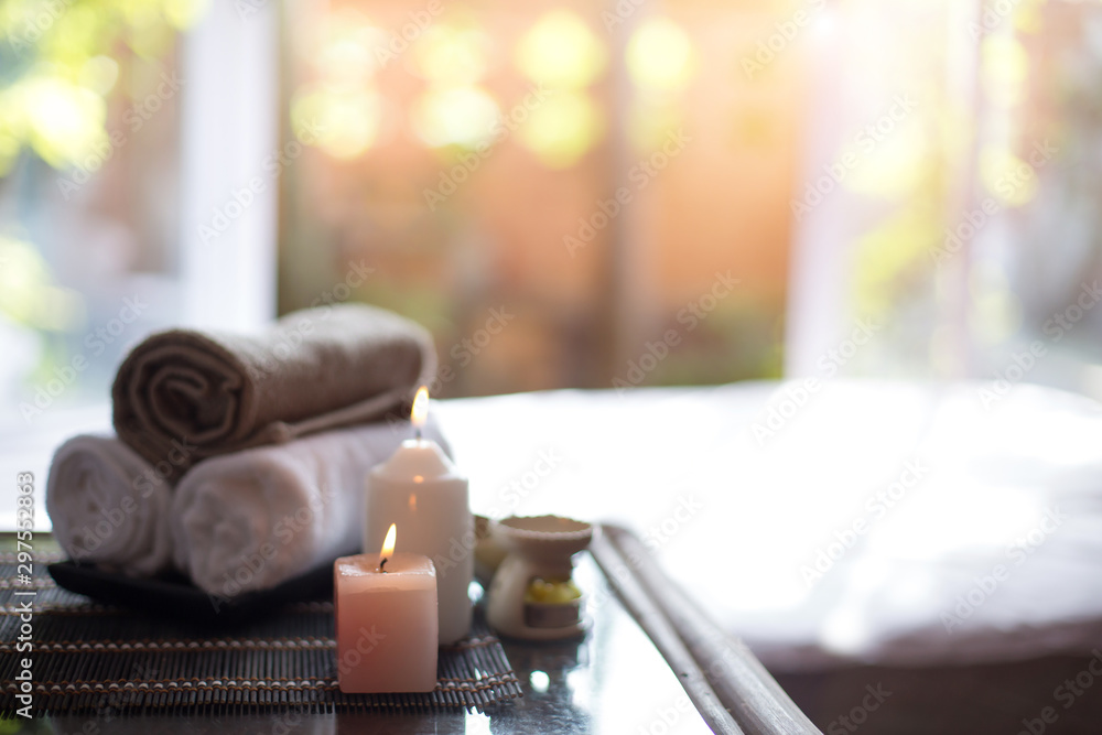 Spa treatments on White spa massage bed with candles, massage oil Spa treatments on White spa massage bed with candles, massage oil