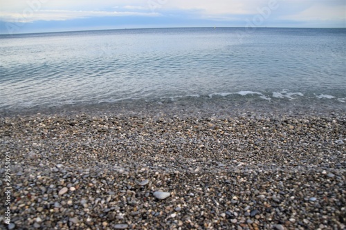 Sea horizon and pebble beach scenery