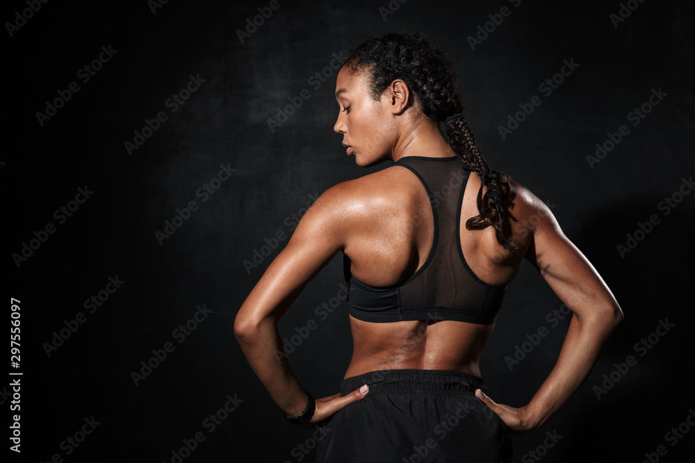 Image from back of slim african american woman in sportswear Image from back of slim african american woman in sportswear