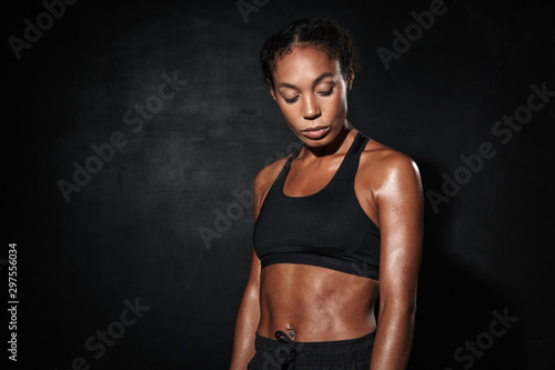Image closeup of serious african american woman in sportswear