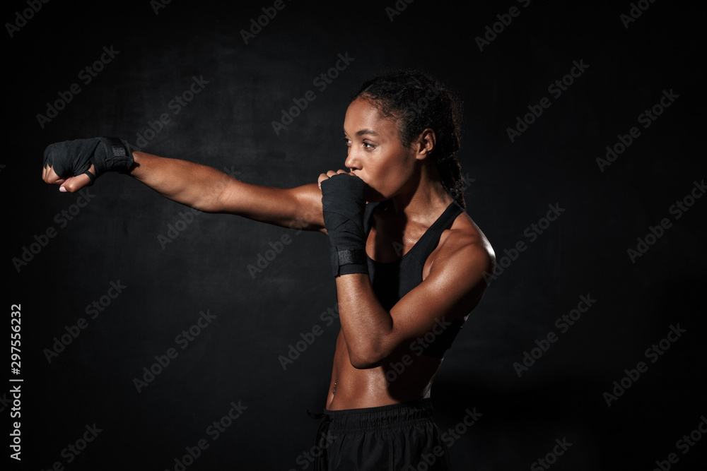Image of serious african american woman boxing in hand wraps Image of serious african american woman boxing in hand wraps