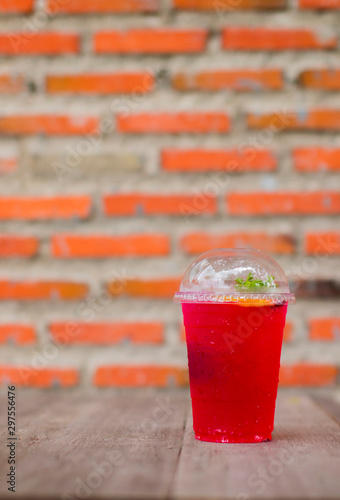 Strawberry soda in a clear plastic glass