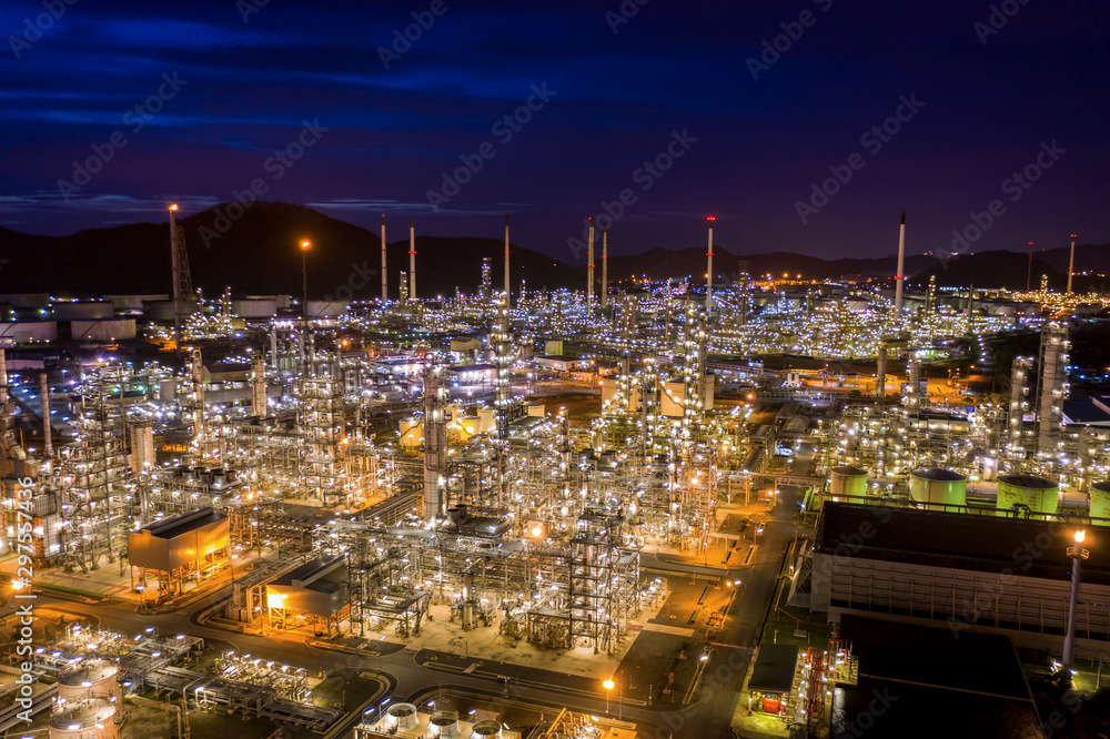 Fototapeta premium twilight landscape refinery oil and gas at night aerial view