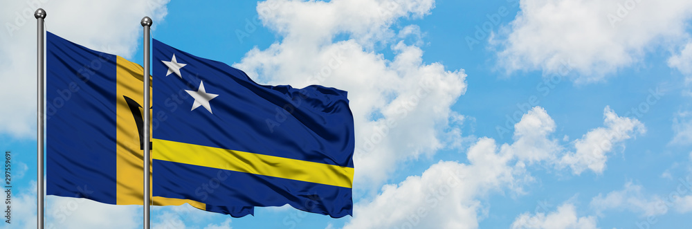 Barbados and Curacao flag waving in the wind against white cloudy blue sky together. Diplomacy concept, international relations. Barbados and Curacao flag waving in the wind against white cloudy blue sky together. Diplomacy concept, international relations.