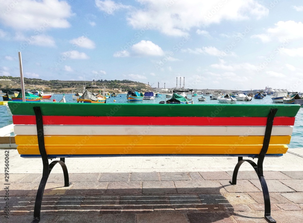 Typical colorful bench on the Marsaxlokk waterfront