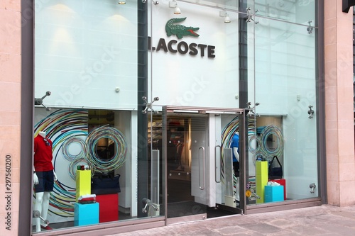 MANCHESTER, UK - APRIL 22, 2013: Lacoste fashion store in Manchester, UK.  Lacoste is present in 112 countries. It exists since 1933 and has 1,000  stores. Stock Photo | Adobe Stock