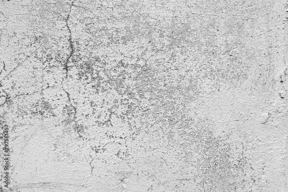 Fototapeta premium Texture of a concrete wall with cracks and scratches which can be used as a background