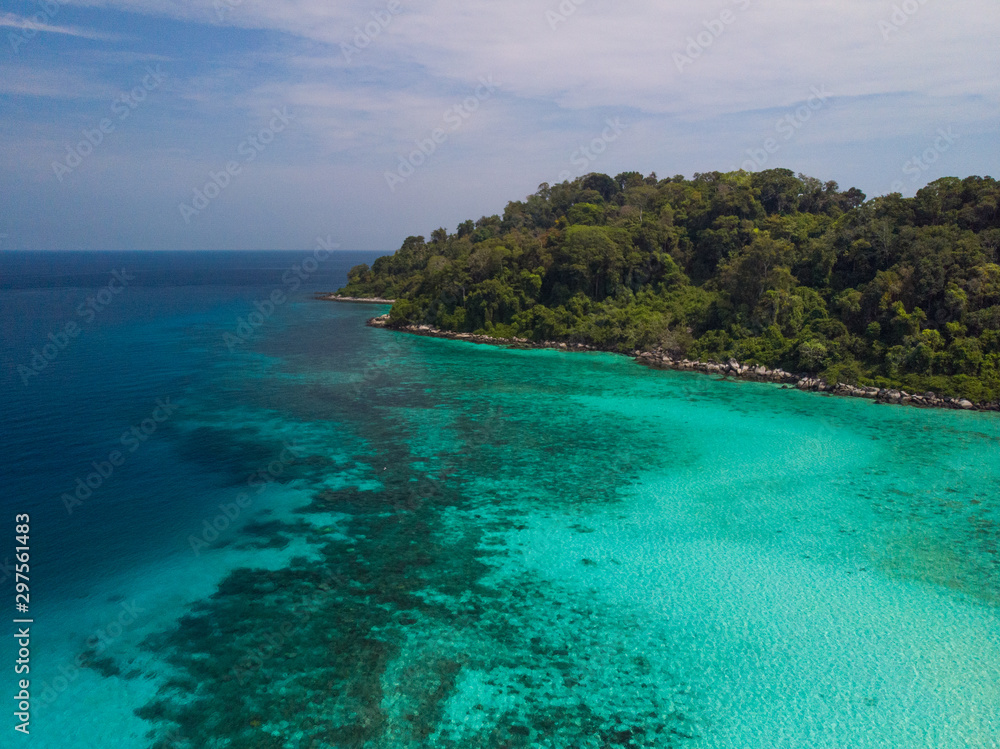 A diving trip in the crystal clear water in front of a lonely island in Southeast Asia A diving trip in the crystal clear water in front of a lonely island in Southeast Asia