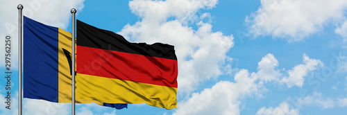 Barbados and Germany flag waving in the wind against white cloudy blue sky together. Diplomacy concept  international relations.