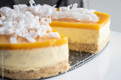 Mango Cheesecake with coconut chips sliced.