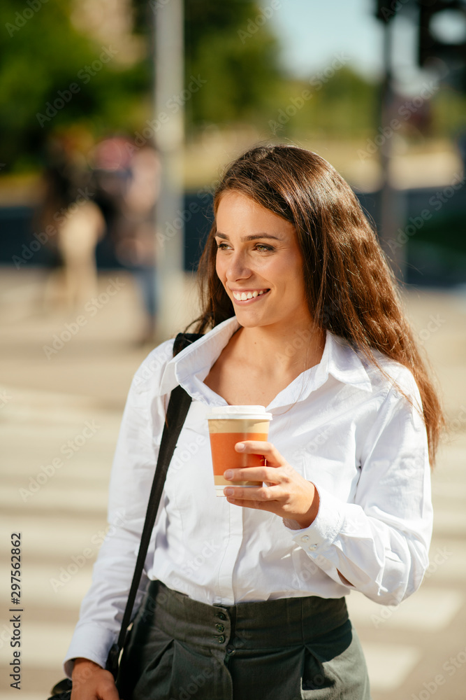 Young businesswoman drinking coffee on the street Young businesswoman drinking coffee on the street