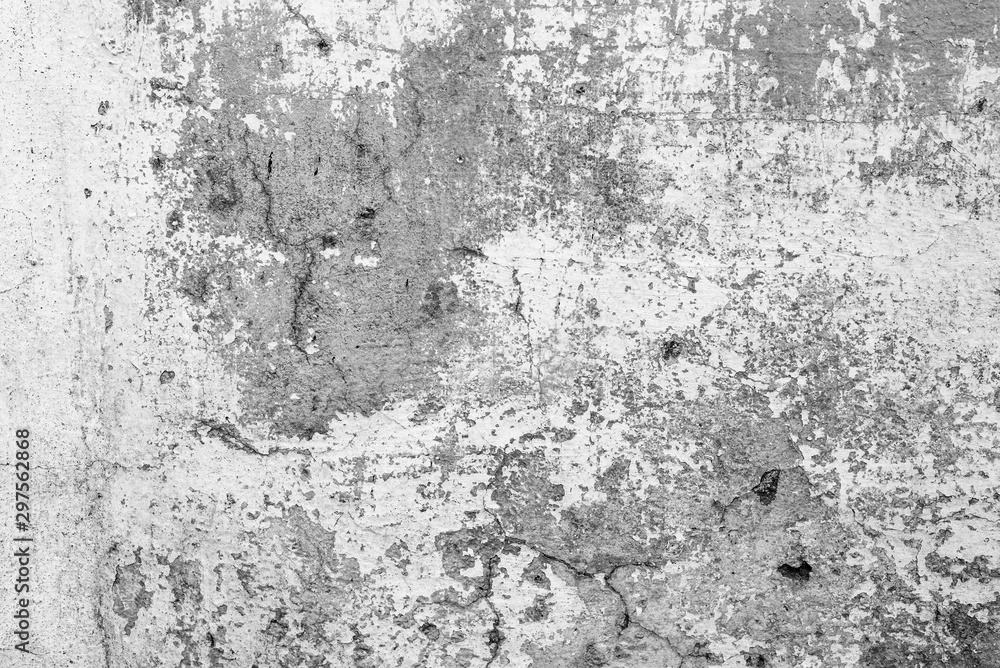 Fototapeta premium Texture of a concrete wall with cracks and scratches which can be used as a background