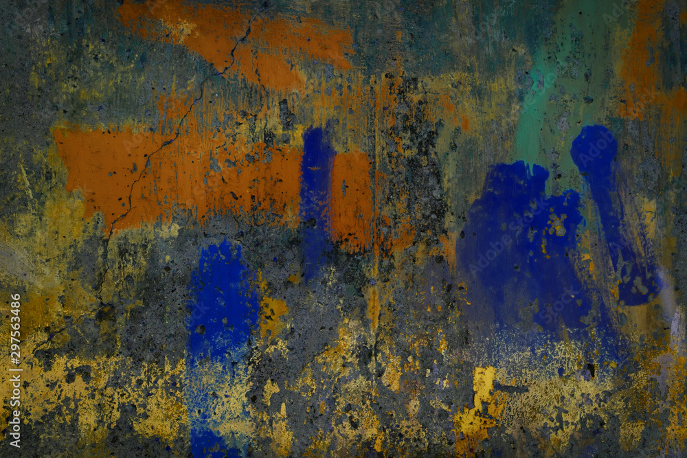 Abstract art texture background. Creative wall art close up. Beautiful dark background. Paint on the wall. Blue, grey, orange, green, yellow and golden old cracked concrete wall surface