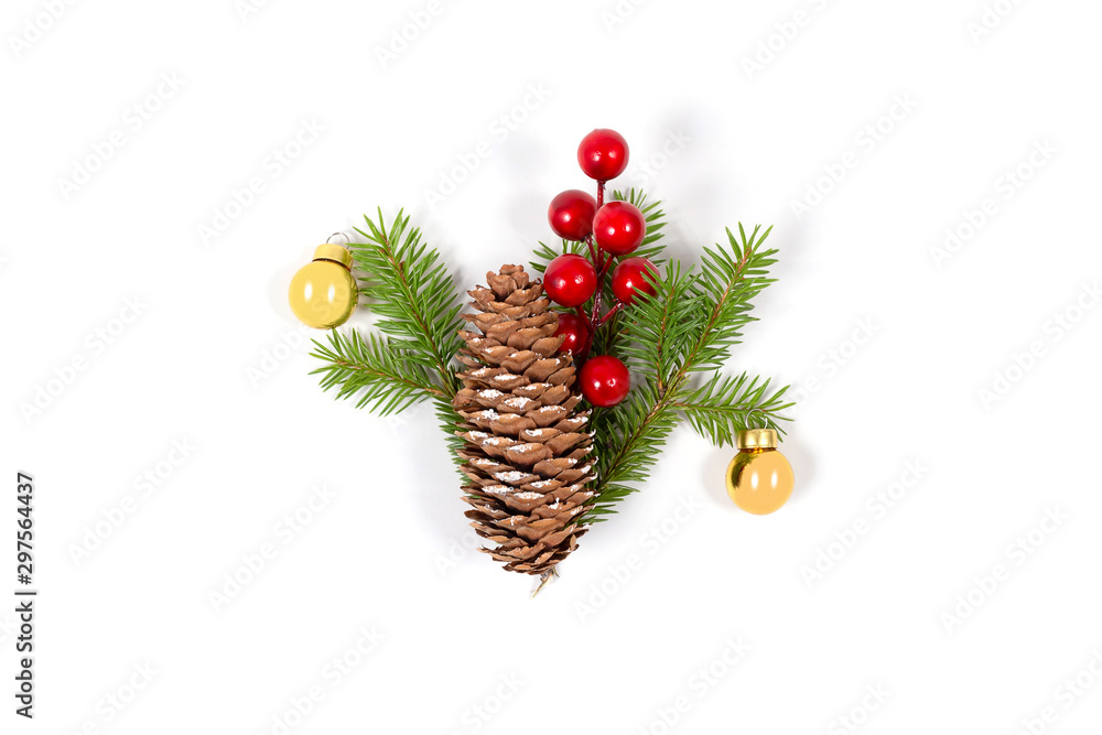 Fototapeta premium Christmas concept. Composition with cone, fir branch, golden balls and red berries. Top view. Isolated on white bakground. New Year greeting card.