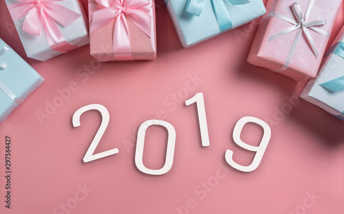 Top view of Pink and blue gift boxes with 2019 on isolated background