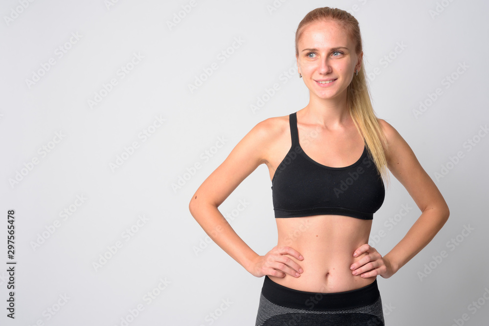 Portrait of happy young blonde woman thinking ready for gym Portrait of happy young blonde woman thinking ready for gym