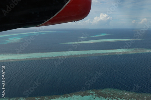 The beautiful atolls of the Maldives seen from a plane