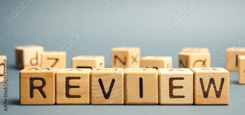 Wooden blocks with the word Review. Customer review concept. Reviewing, auditing, reviewer. Service rating. Feedback. photo