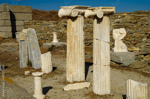 Ancient and historic temple ruins with columns and walls on archeologic site museum island Delos excavation site in Greece in the Aegean Sea with Apollon Sanctuary photo