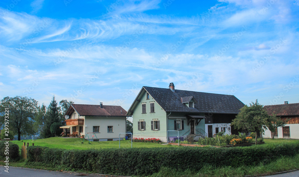 Beautiful cozy European houses surrounded by a garden in Liechtenstein. Beautiful cozy European houses surrounded by a garden in Liechtenstein.