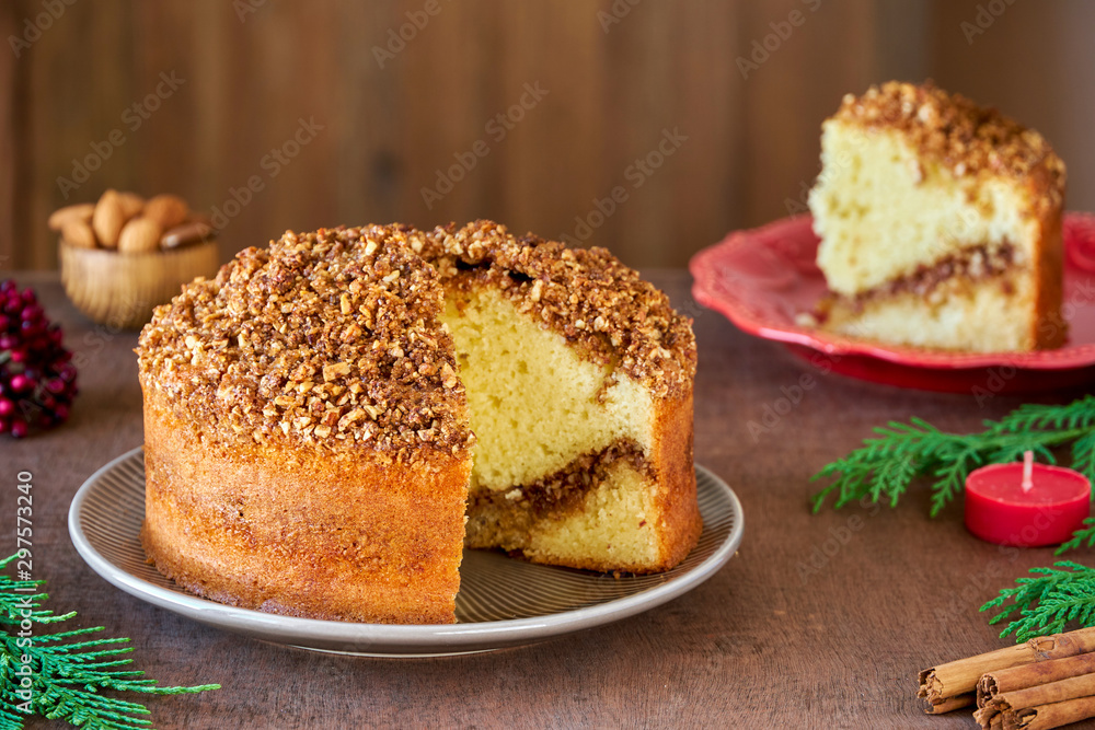 Almond cinnamon cake on wooden table. Close up Almond cinnamon cake on wooden table. Close up