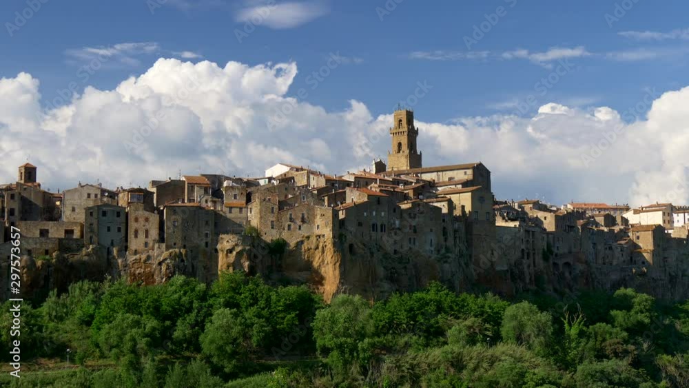 Pitigliano, Italy. Panoramic shot of the town with a tower and houses. 4K Pitigliano, Italy. Panoramic shot of the town with a tower and houses. 4K