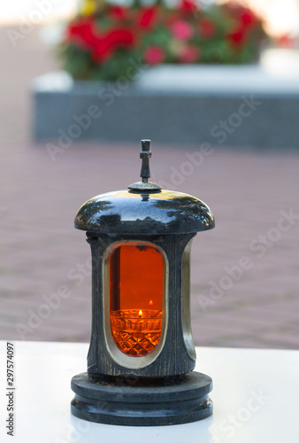 Memorial candle in the cemetery photo