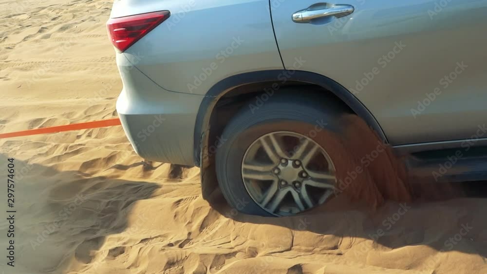 Car tire stuck in sand offroad Stock Video Adobe Stock