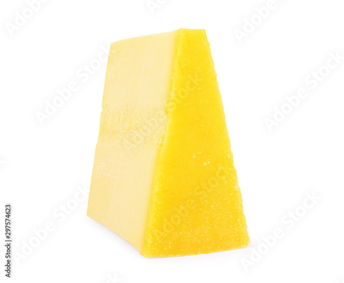 A piece of parmesan cheese on a white background
