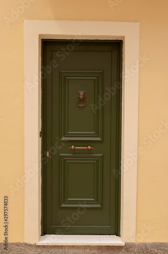 Green front door, front view an inviting house