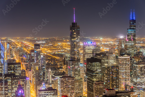 Aerial view illuminated skyscrapers in downtown Chicago at dusk