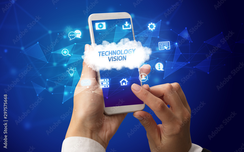 Female hand holding smartphone with TECHNOLOGY VISION inscription, cloud technology concept Female hand holding smartphone with TECHNOLOGY VISION inscription, cloud technology concept