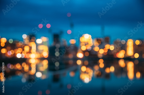 Oslo, Norway. Night Abstract Boke Bokeh Background Effect. Design Backdrop. Night View Embankment And Residential Multi-storey House In Gamle Oslo District. Residential Area Reflected In Sea Waters