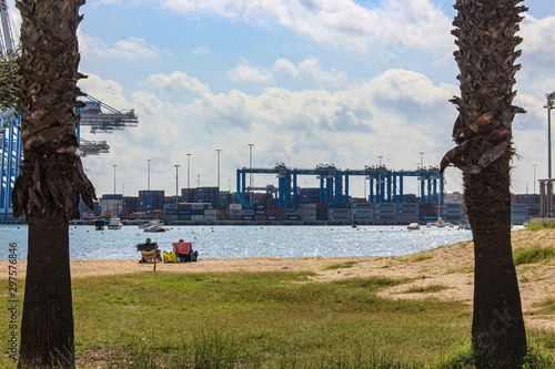 Bild auf Leinwand Beach and the free port